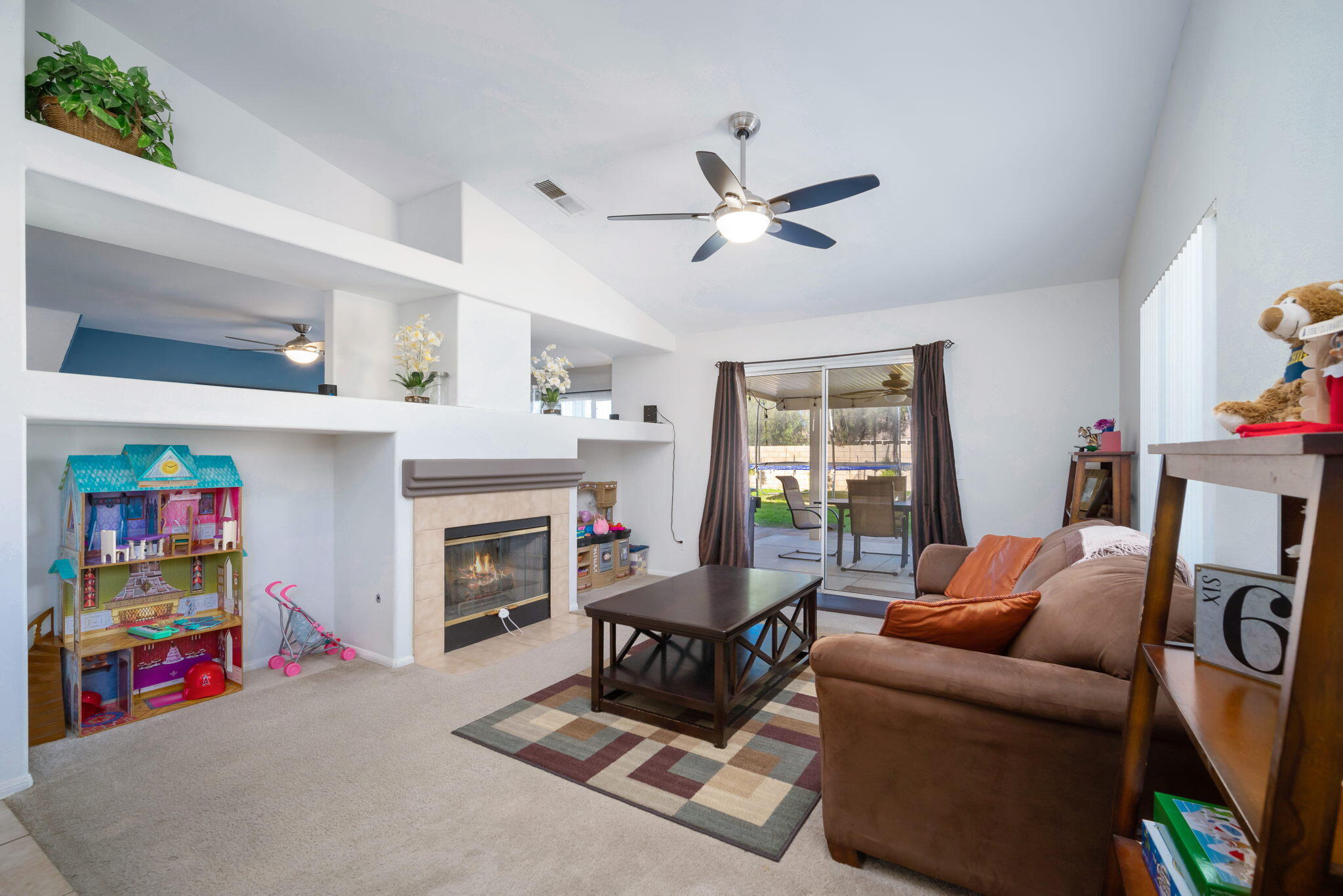 79350 Paseo Del Rey La Quinta, CA 92253 - Photo 9 of 41 a living room with furniture and a fireplace