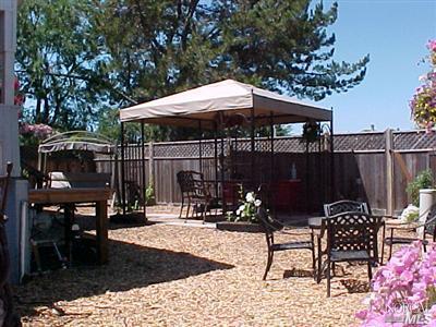 144 Bryce Canyon Road, Unit 99999 San Rafael, CA 94903 - Photo 4 of 7 a patio with glass top table and chairs