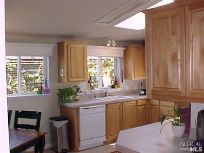 144 Bryce Canyon Road, Unit 99999 San Rafael, CA 94903 - Photo 5 of 7 a kitchen with a sink window and cabinets