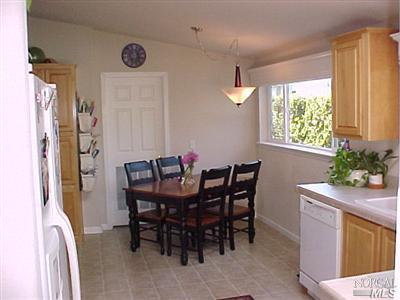 144 Bryce Canyon Road, Unit 99999 San Rafael, CA 94903 - Photo 6 of 7 a view of a dining room with furniture and window