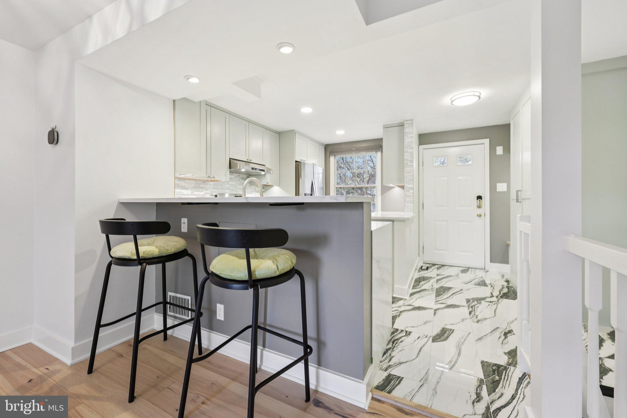 1666 Harvest Green Court Reston, VA 20194 - Photo 7 of 46 Breakfast Bar Overlooks Kitchen