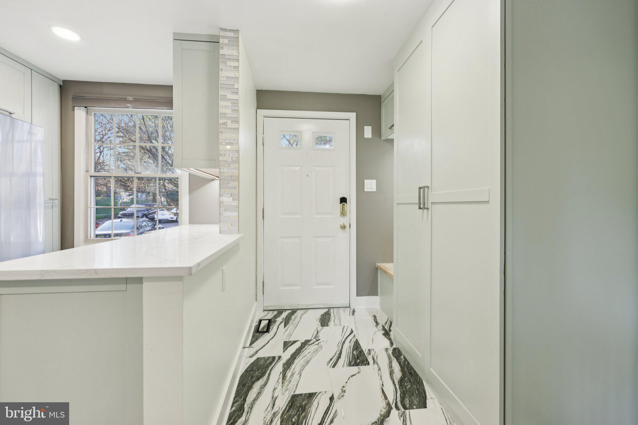 1666 Harvest Green Court Reston, VA 20194 - Photo 9 of 46 Entrance into Foyer/Mudroom Porcelain Flooring