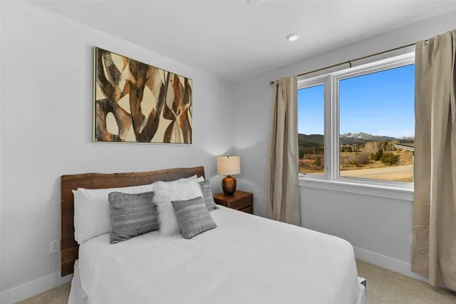 a bedroom with a bed and a view of bathroom