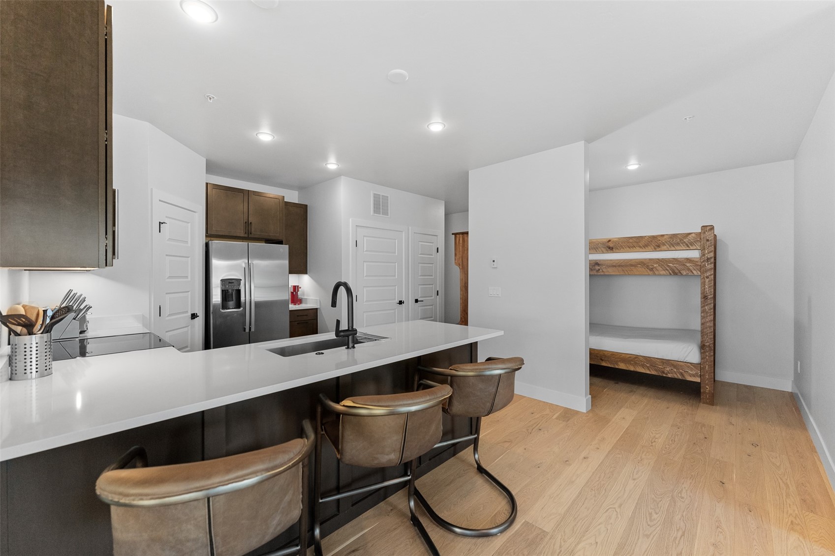 125 West Keystone Road, Unit 105 Keystone, CO 80435 - Photo 6 of 29 a kitchen with a sink cabinets and wooden floor