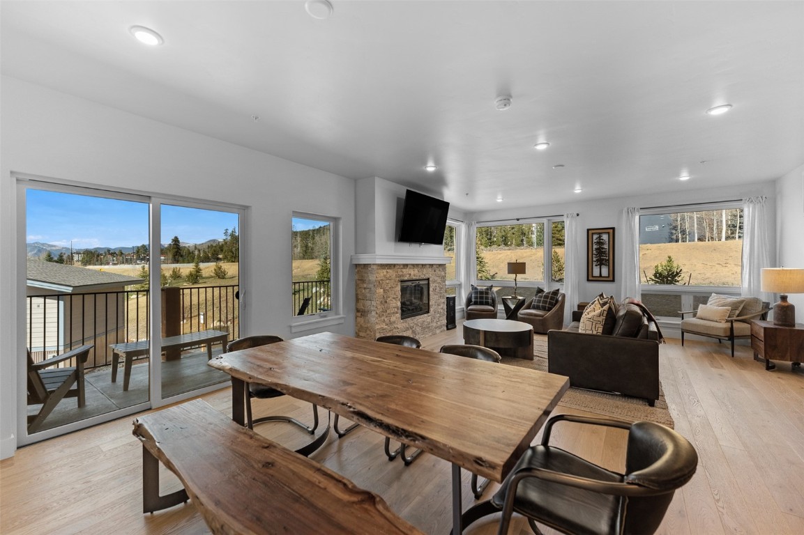 125 West Keystone Road, Unit 105 Keystone, CO 80435 - Photo 8 of 32 a view of a dining room with furniture window and wooden floor