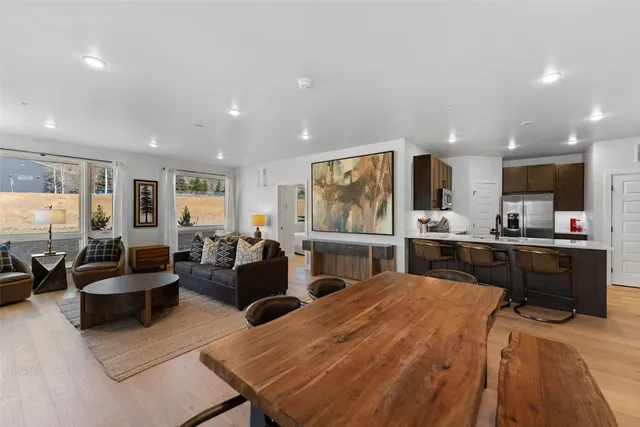 a living room with fireplace furniture and a flat screen tv
