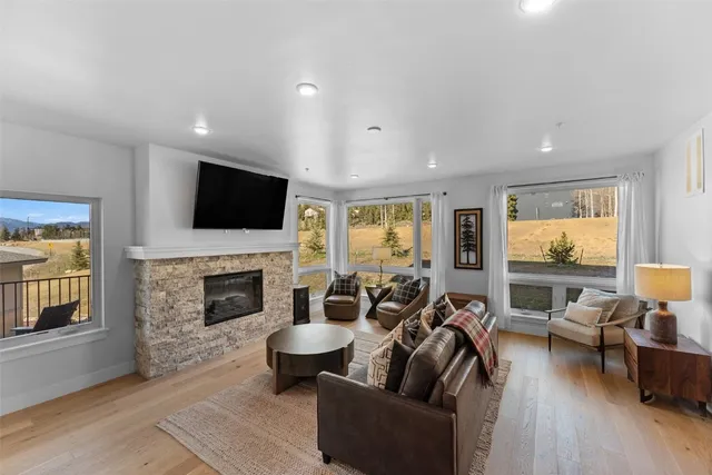 a living room with furniture fireplace and a flat screen tv