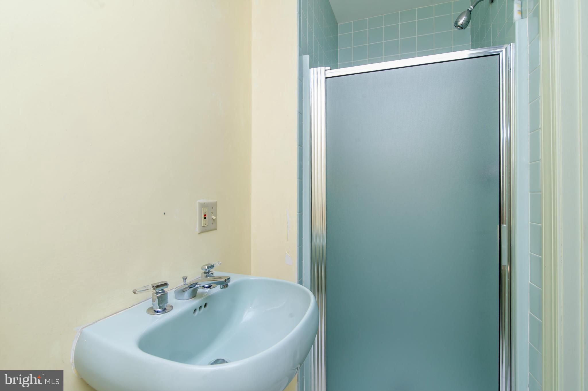 17615 Falls Road Upperco, MD 21155 - Photo 15 of 26 a bathroom with a sink and a mirror