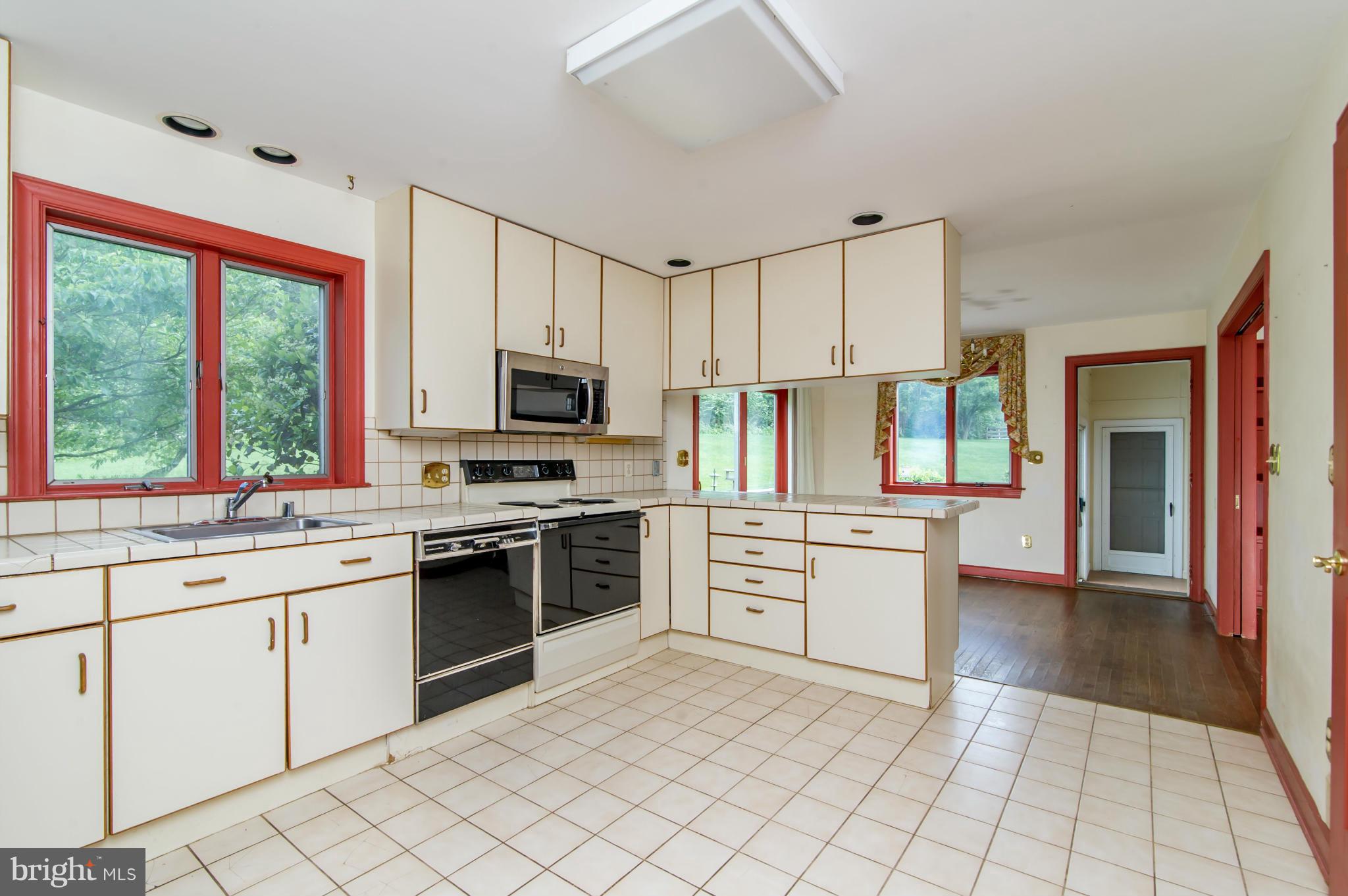 17615 Falls Road Upperco, MD 21155 - Photo 4 of 26 a kitchen with appliances cabinets and a sink