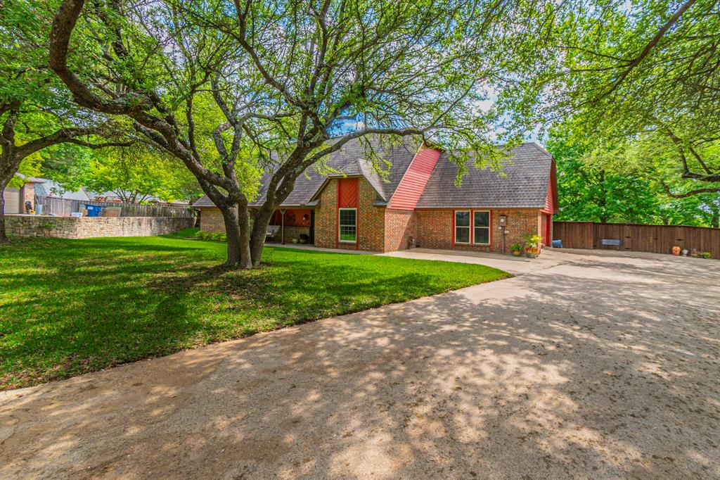 127 Nicklaus Nook Lancaster, TX 75146 - Photo 2 of 37 View of front of home with driveway, a shingled roof, and brick siding