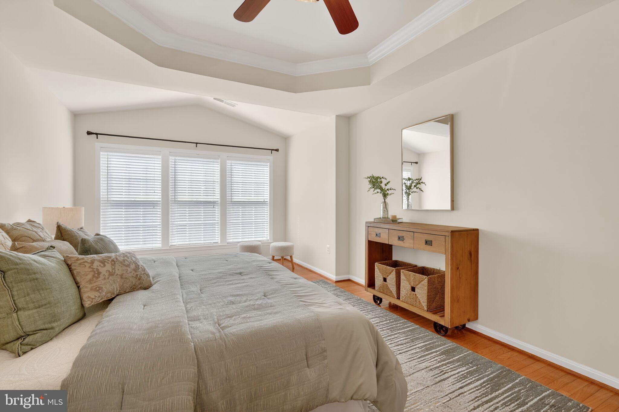 9144 Furey Road Lorton, VA 22079 - Photo 14 of 28 a spacious bedroom with a bed and a window