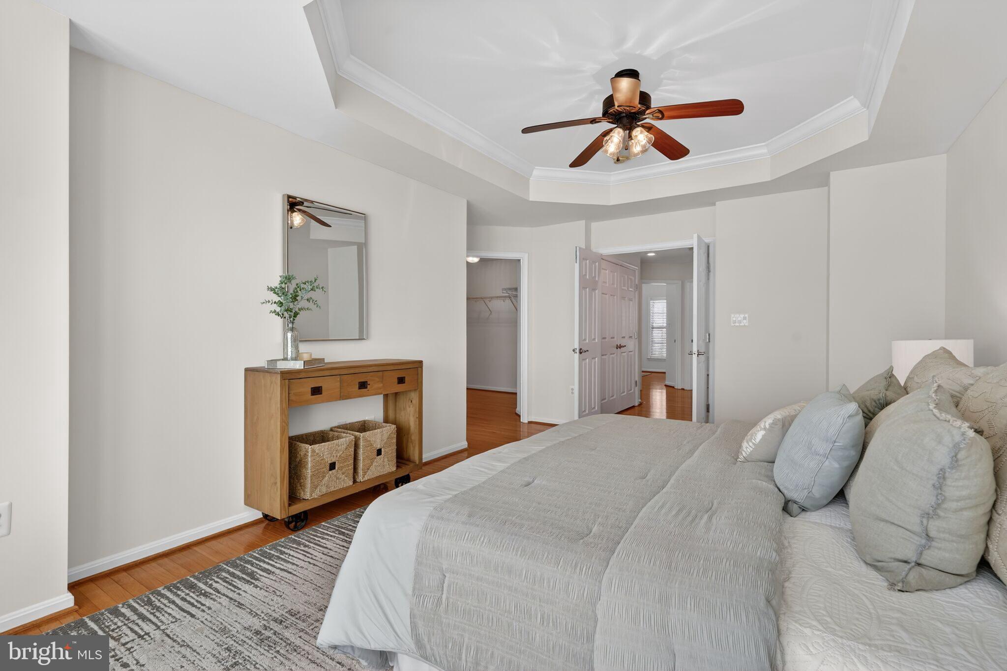 9144 Furey Road Lorton, VA 22079 - Photo 15 of 28 a bedroom with a bed and a chandelier