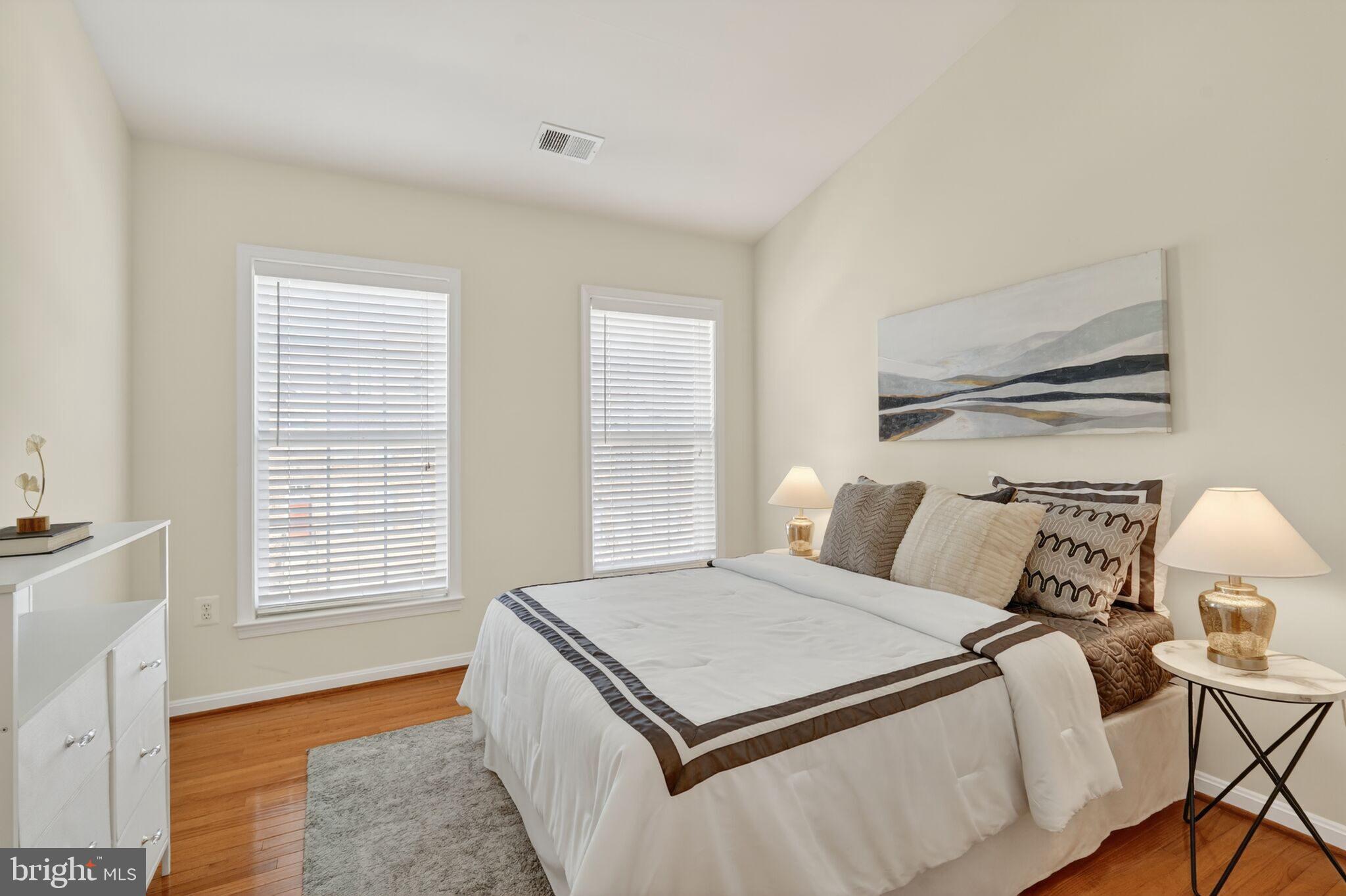 9144 Furey Road Lorton, VA 22079 - Photo 18 of 28 a bed sitting in a bedroom next to a window