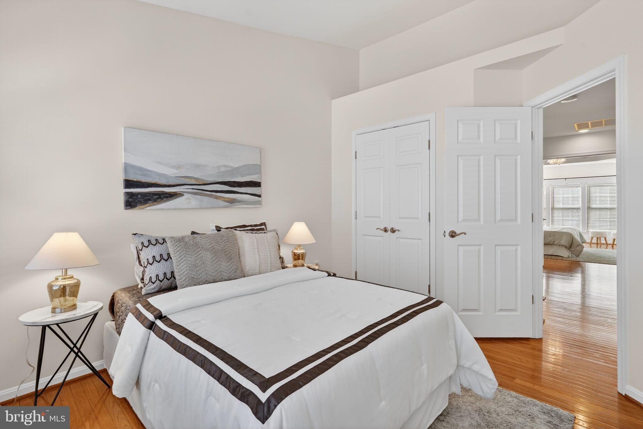 9144 Furey Road Lorton, VA 22079 - Photo 19 of 28 a bedroom with a bed and wooden floor