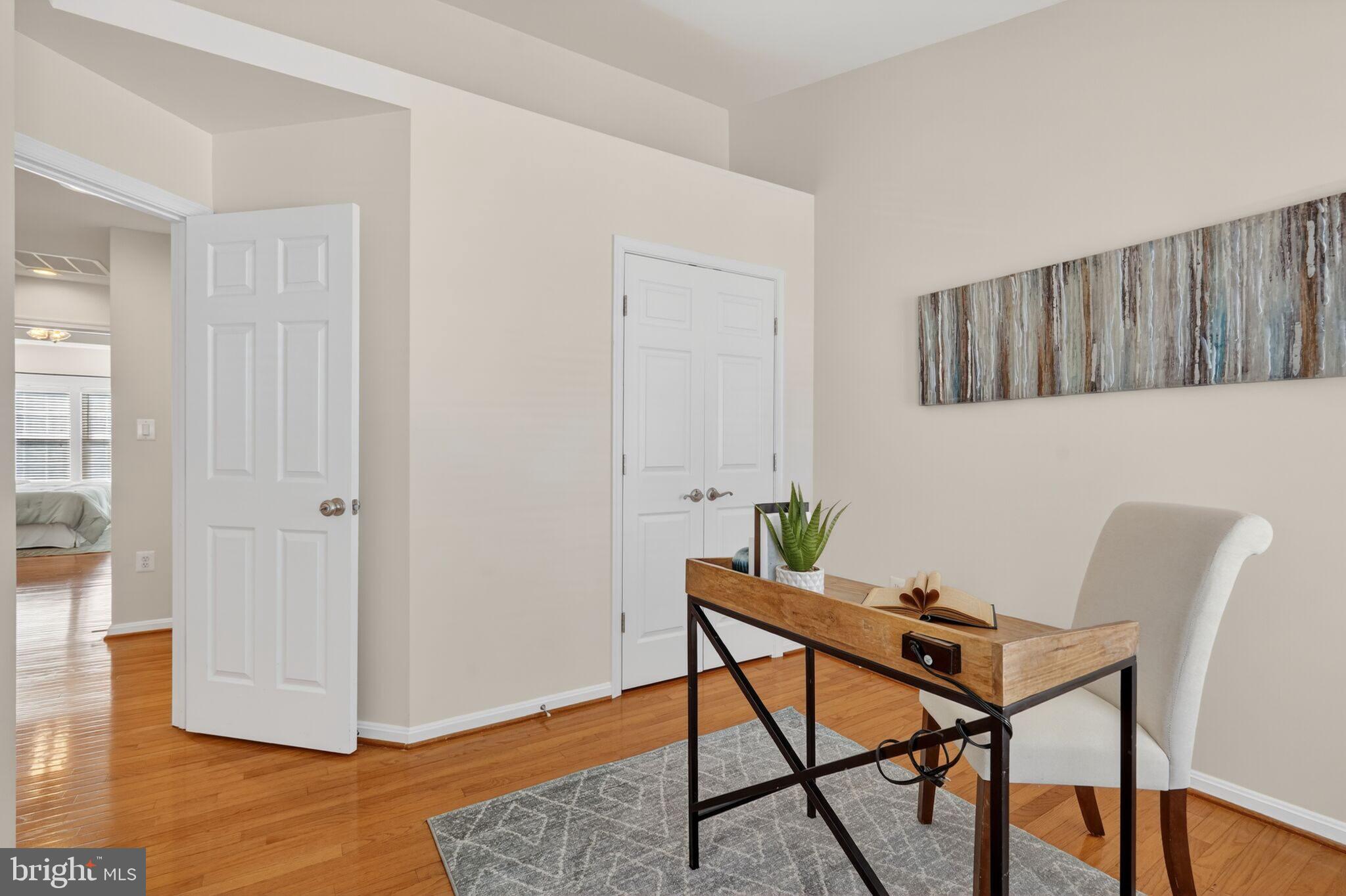 9144 Furey Road Lorton, VA 22079 - Photo 22 of 28 a workspace room with furniture and wooden floor