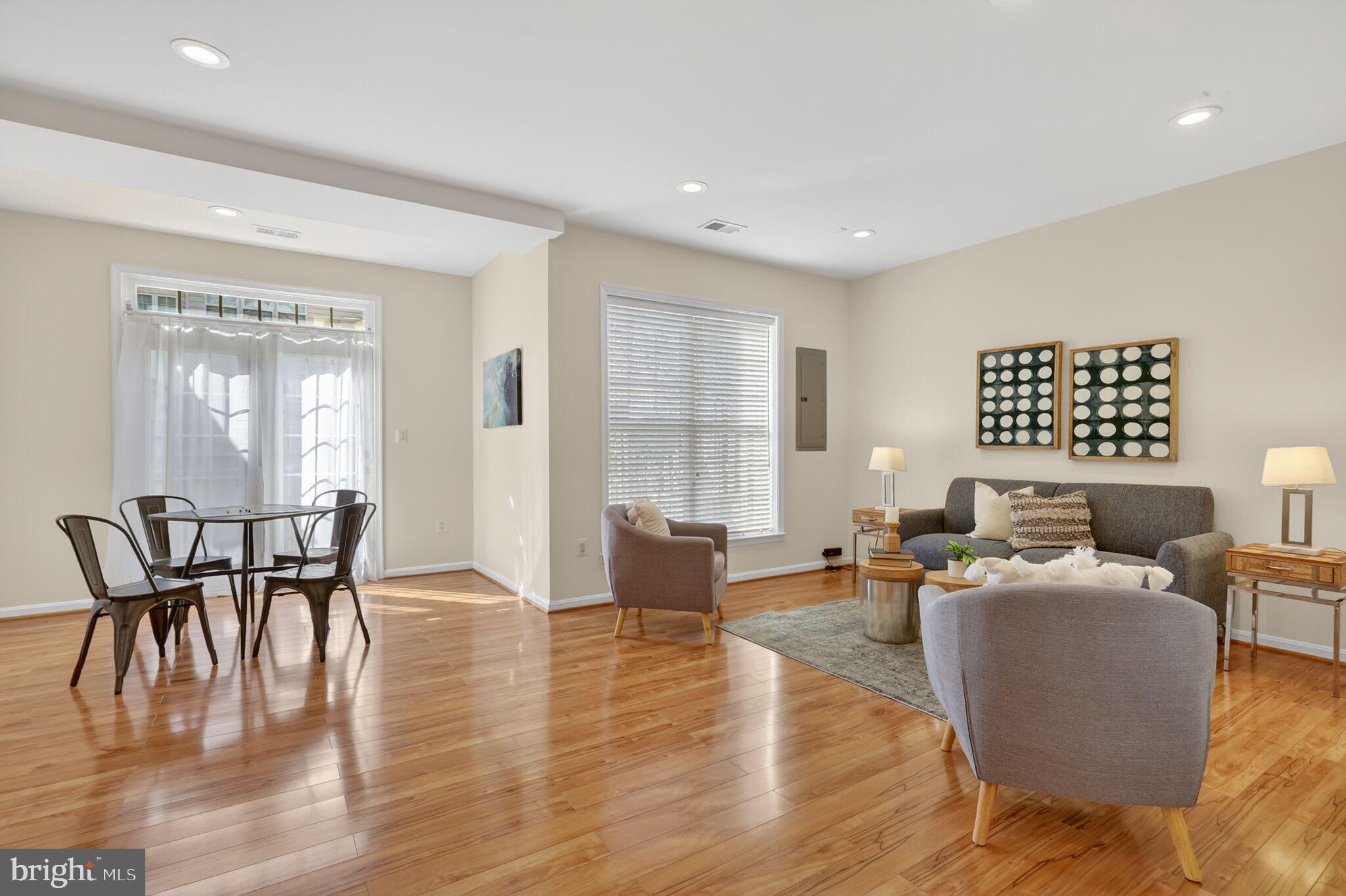 9144 Furey Road Lorton, VA 22079 - Photo 23 of 28 a living room with furniture wooden floor and a lamp