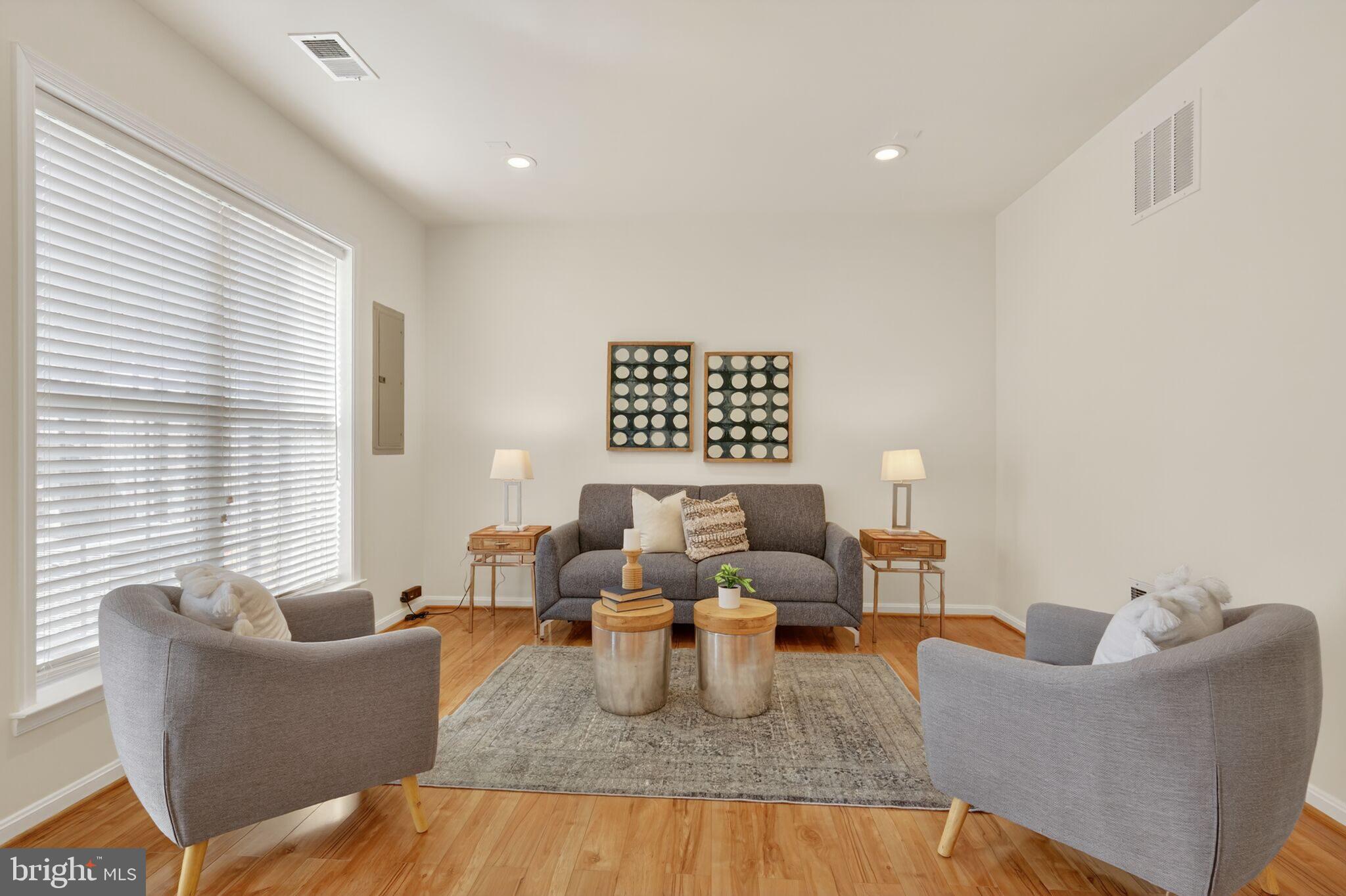 9144 Furey Road Lorton, VA 22079 - Photo 24 of 28 a living room with furniture or window and a table
