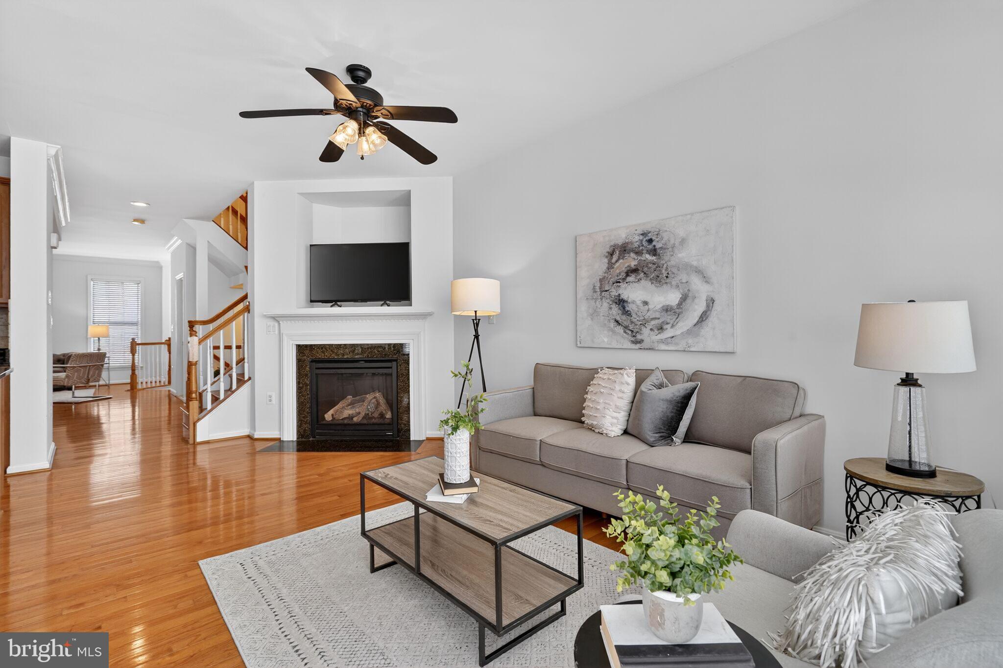 9144 Furey Road Lorton, VA 22079 - Photo 8 of 28 a living room with furniture and a fireplace