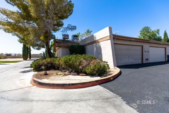 1016 Peg Street Ridgecrest, CA 93555 - Photo 4 of 26 a view of a house with a yard fire pit and outdoor space