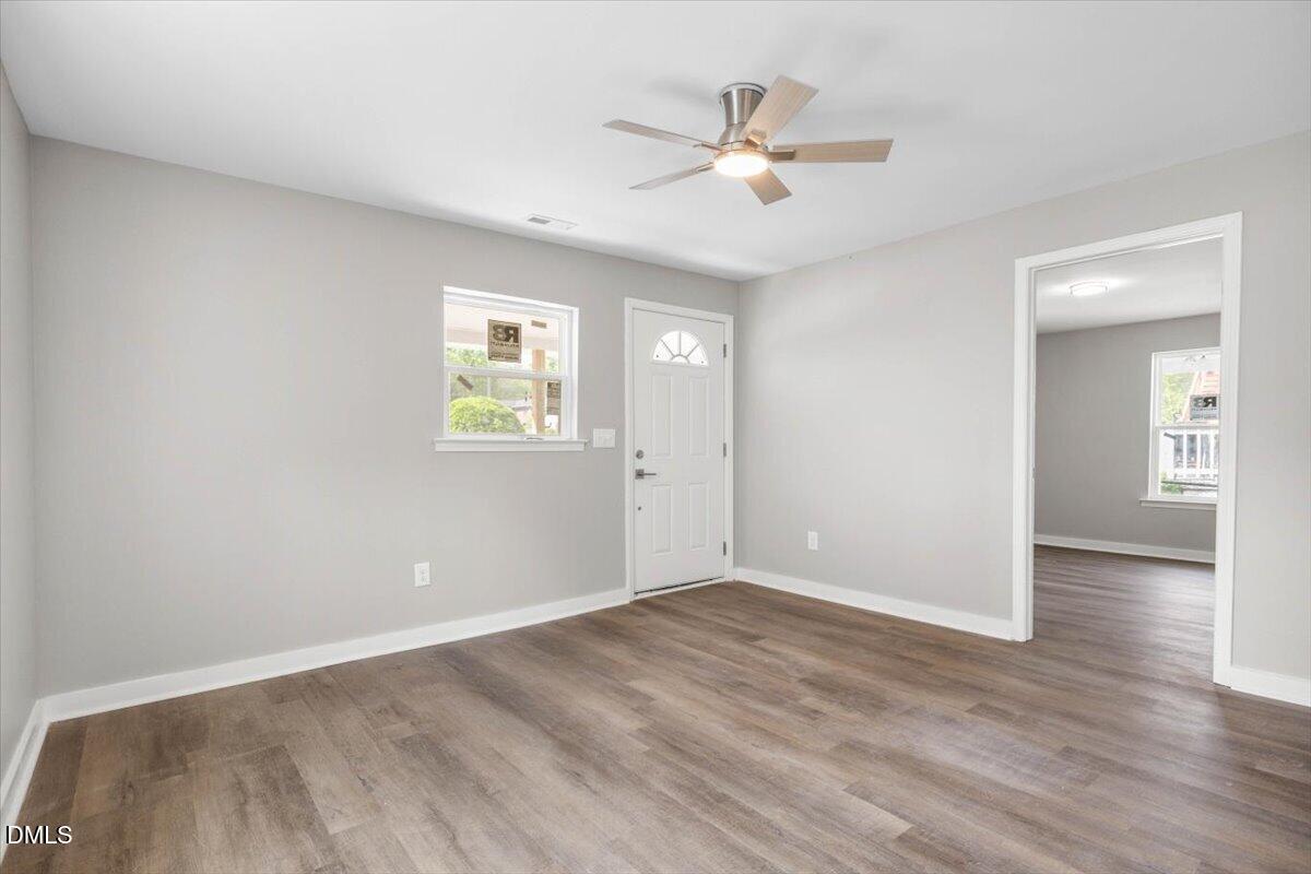 509 Sparella Street Durham, NC 27703 - Photo 6 of 30 a view of an empty room with wooden floor