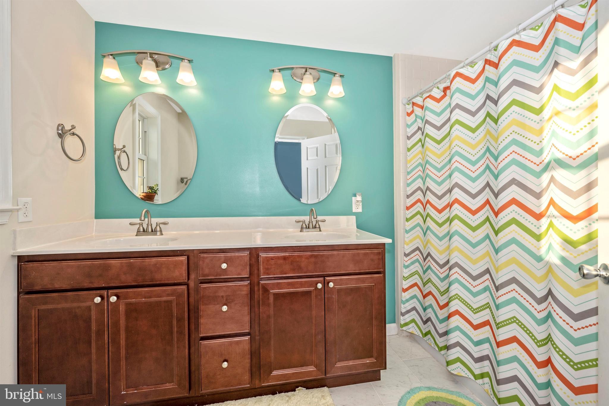 12529 Fingerboard Road Monrovia, MD 21770 - Photo 35 of 55 a bathroom with a sink and a mirror