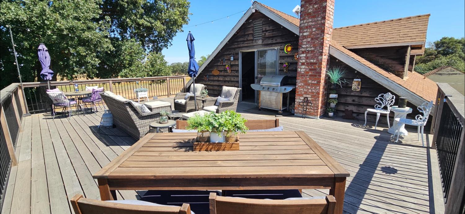 20822 Disch Road Lockeford, CA 95237 - Photo 19 of 30 a view of deck with patio table and chairs