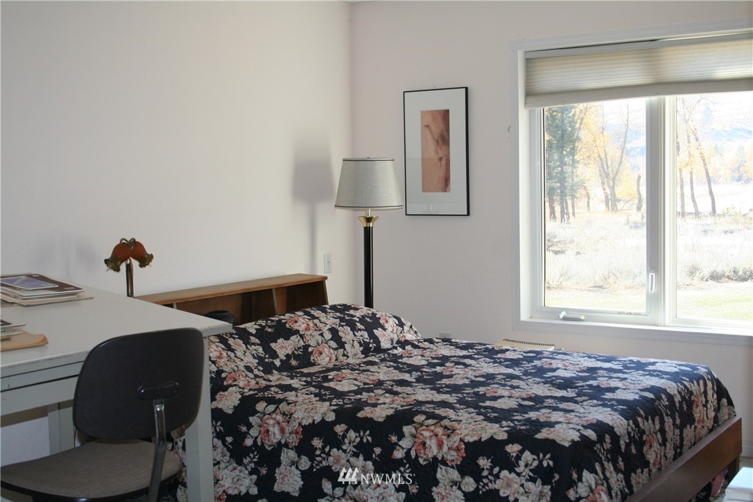 46 Beaver Pond Road Twisp, WA 98856 - Photo 20 of 31 a bedroom with bed and a window