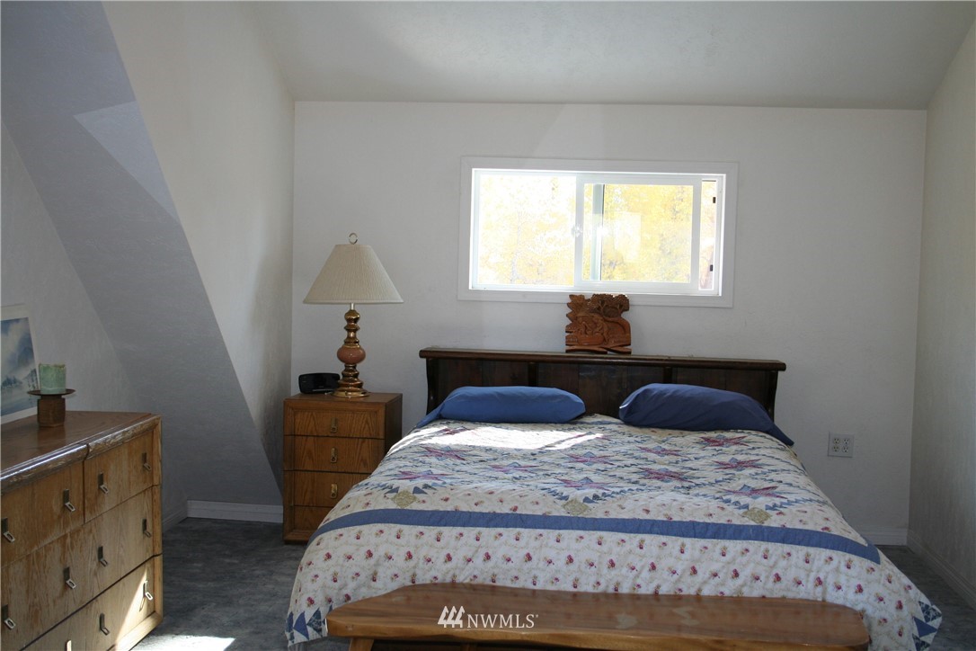 46 Beaver Pond Road Twisp, WA 98856 - Photo 25 of 31 a bedroom with a bed and window