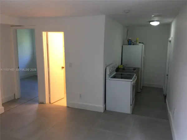 a view of a storage & utility room with closet