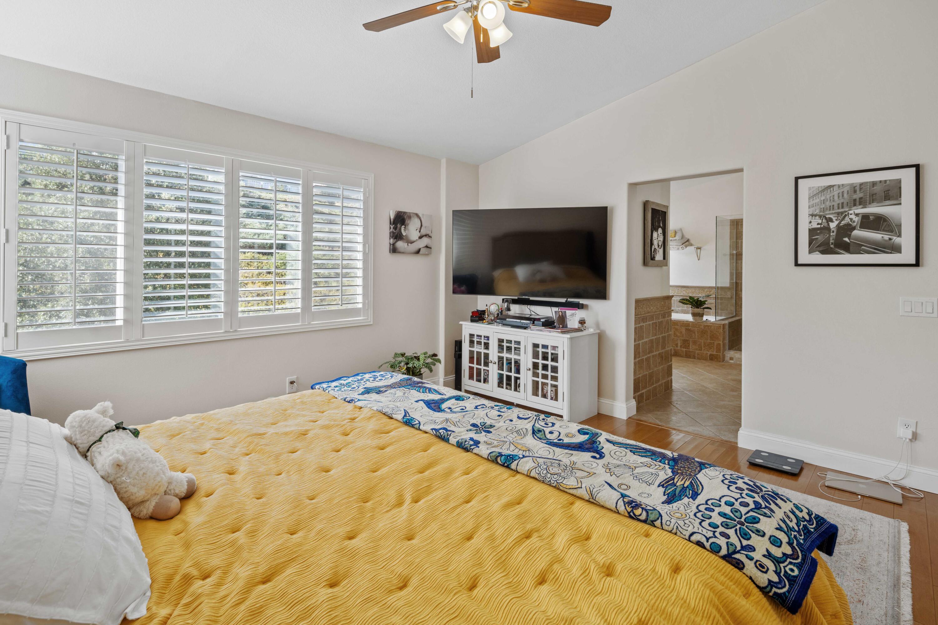 26089 Salinger Lane Stevenson Ranch, CA 91381 - Photo 25 of 43 a bedroom with a bed and a flat screen tv