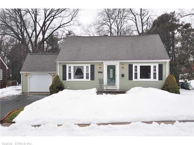 a view of house with yard and covered with snow