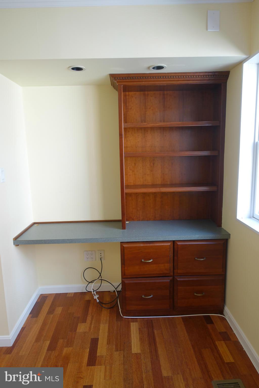 1526 12th Street Northwest, Unit 2 Washington, DC 20005 - Photo 12 of 15 a room with a wooden floor and a window