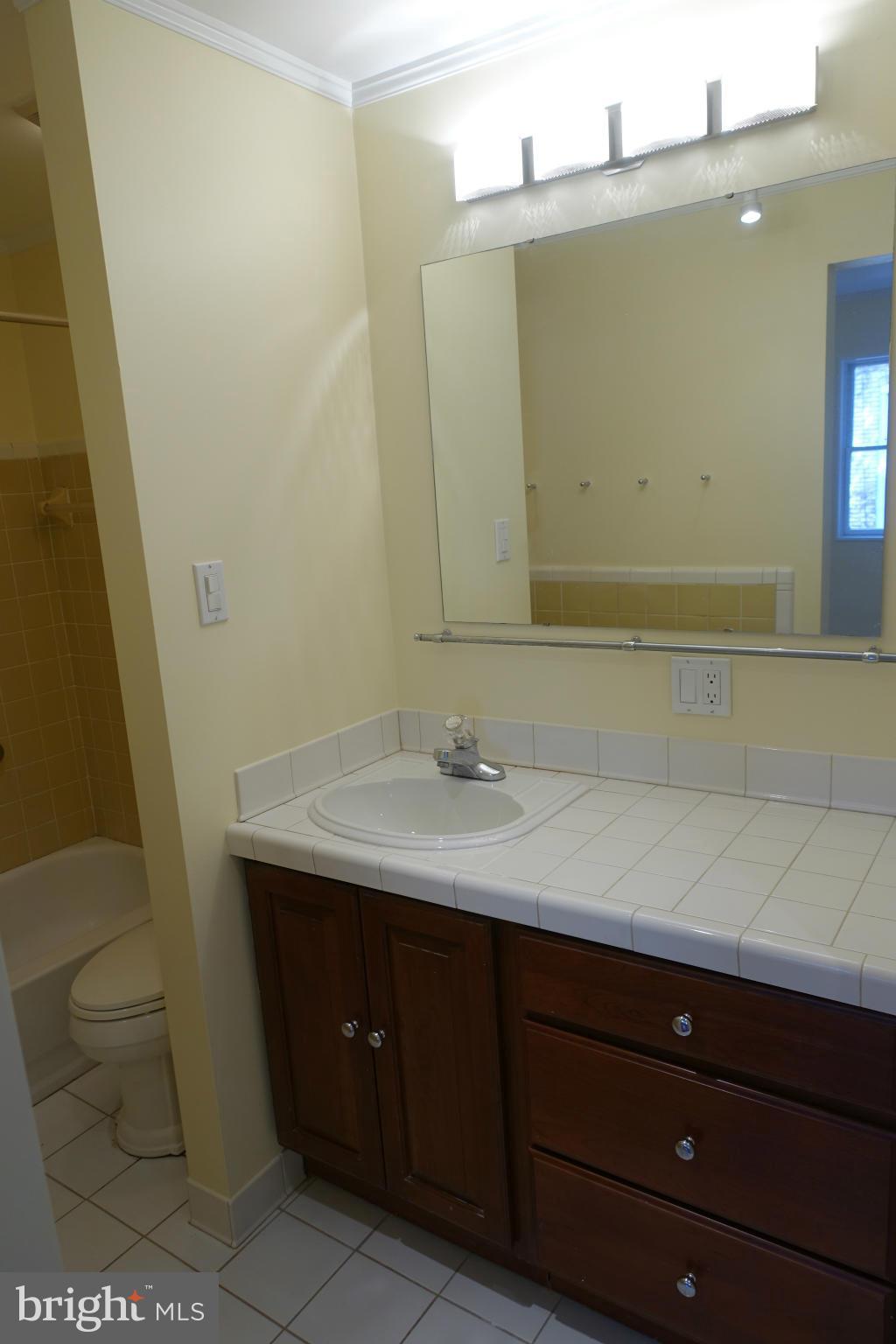 1526 12th Street Northwest, Unit 2 Washington, DC 20005 - Photo 14 of 15 a bathroom with a sink and a mirror