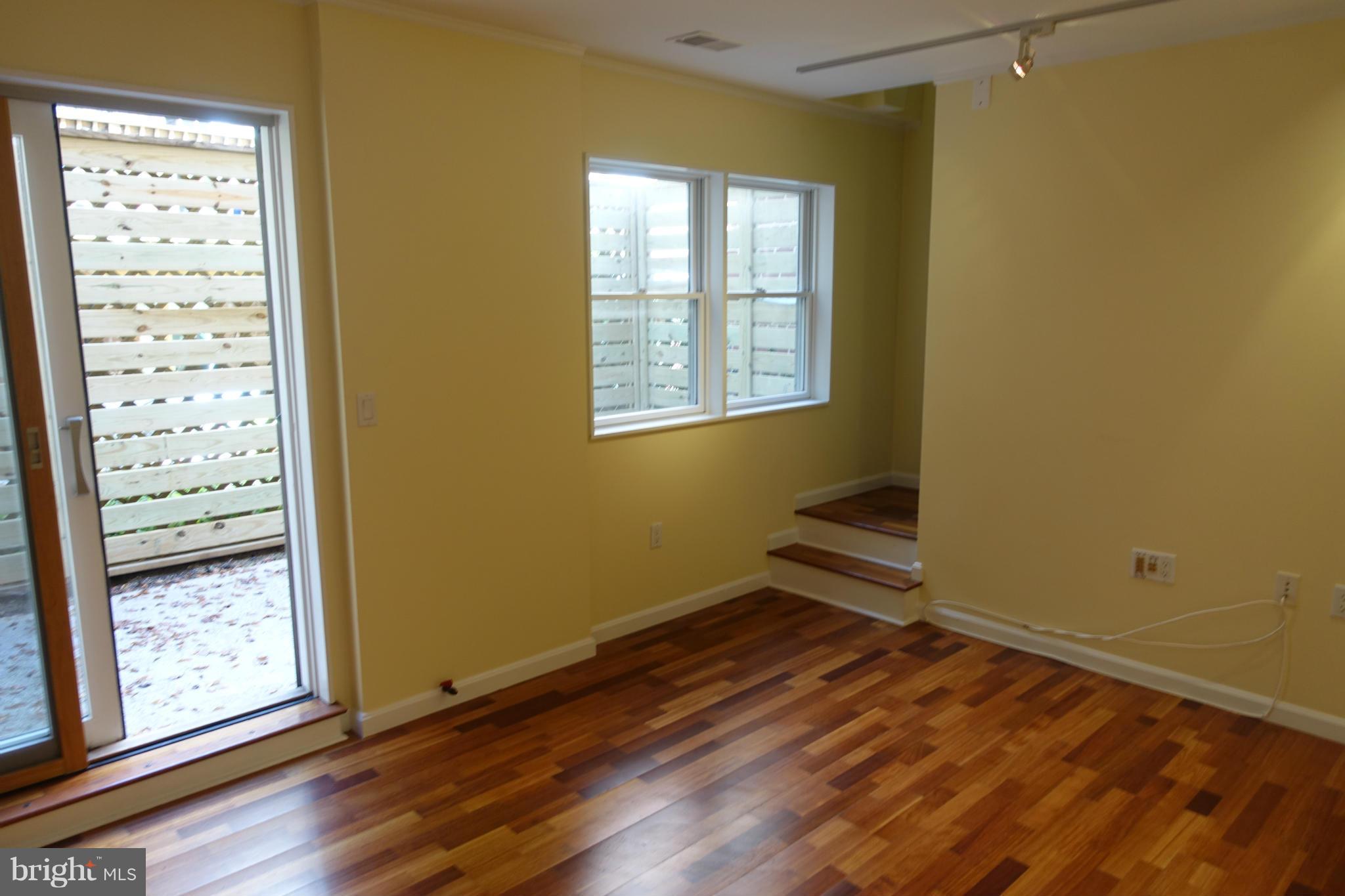1526 12th Street Northwest, Unit 2 Washington, DC 20005 - Photo 7 of 15 an empty room with windows