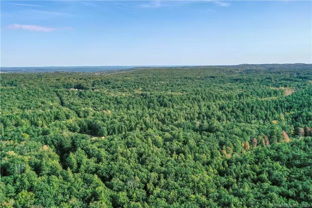 an aerial view of houses with yard