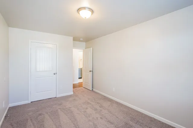 a bathroom with a bathtub shower sink vanity and toilet