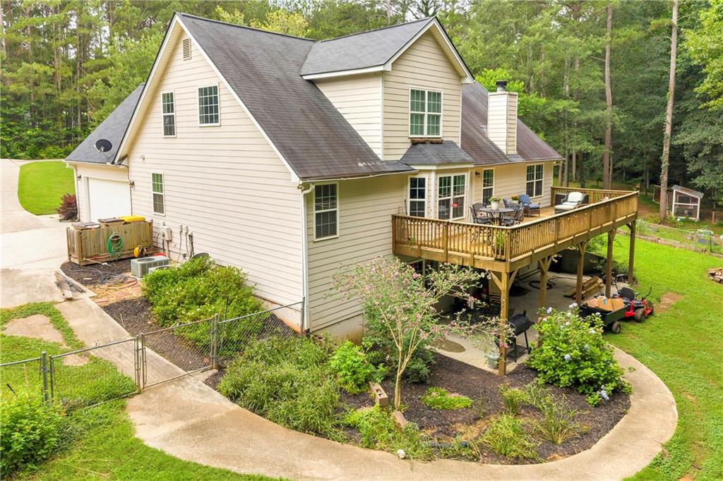 587-j B J B Owens Road Bethlehem, GA 30620 - Photo 5 of 99 a aerial view of a house with swimming pool and garden