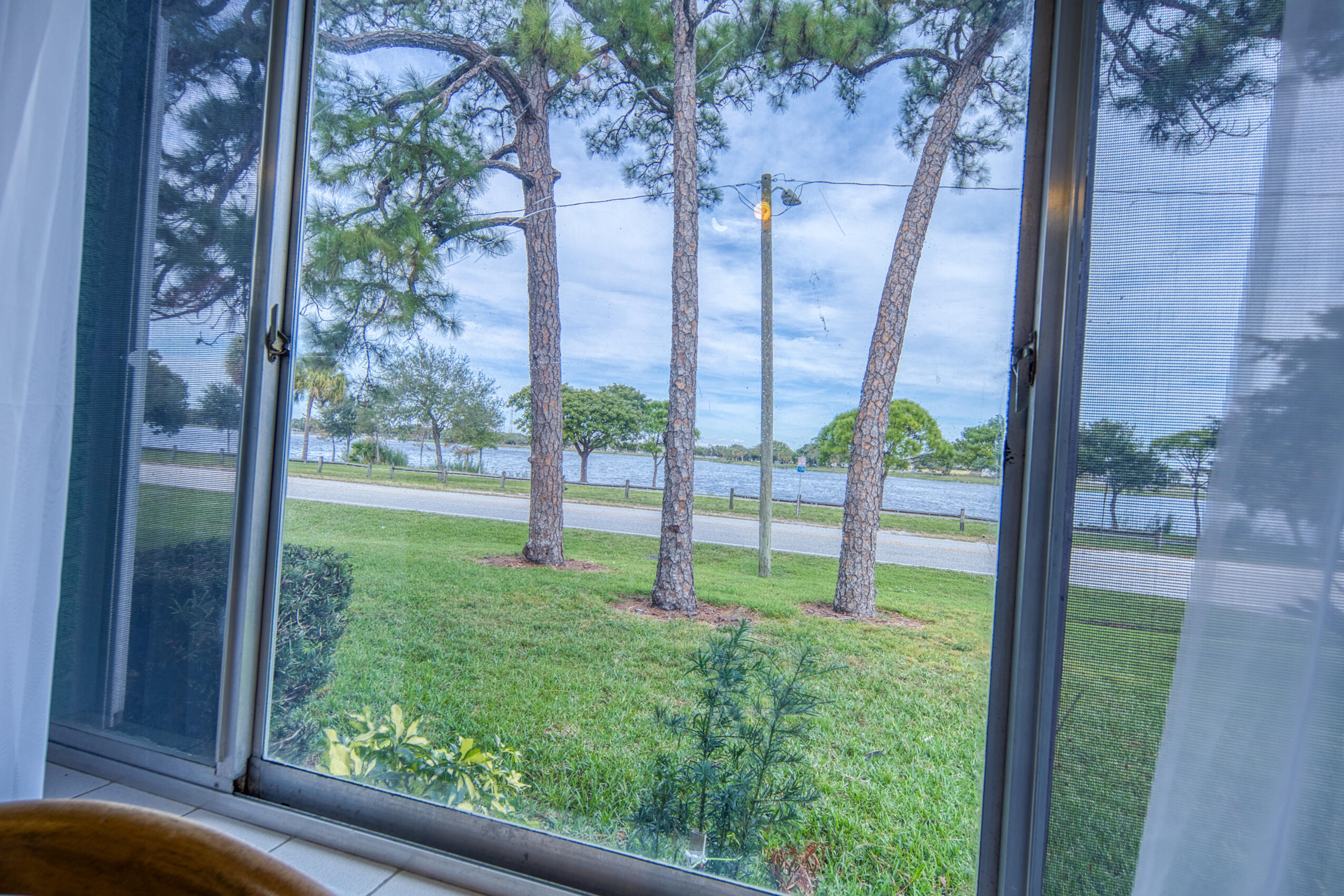 2004 Lake Osborne Drive, Unit 1 Lake Worth Beach, FL 33461 - Photo 1 of 30 a view of a yard with a from a window