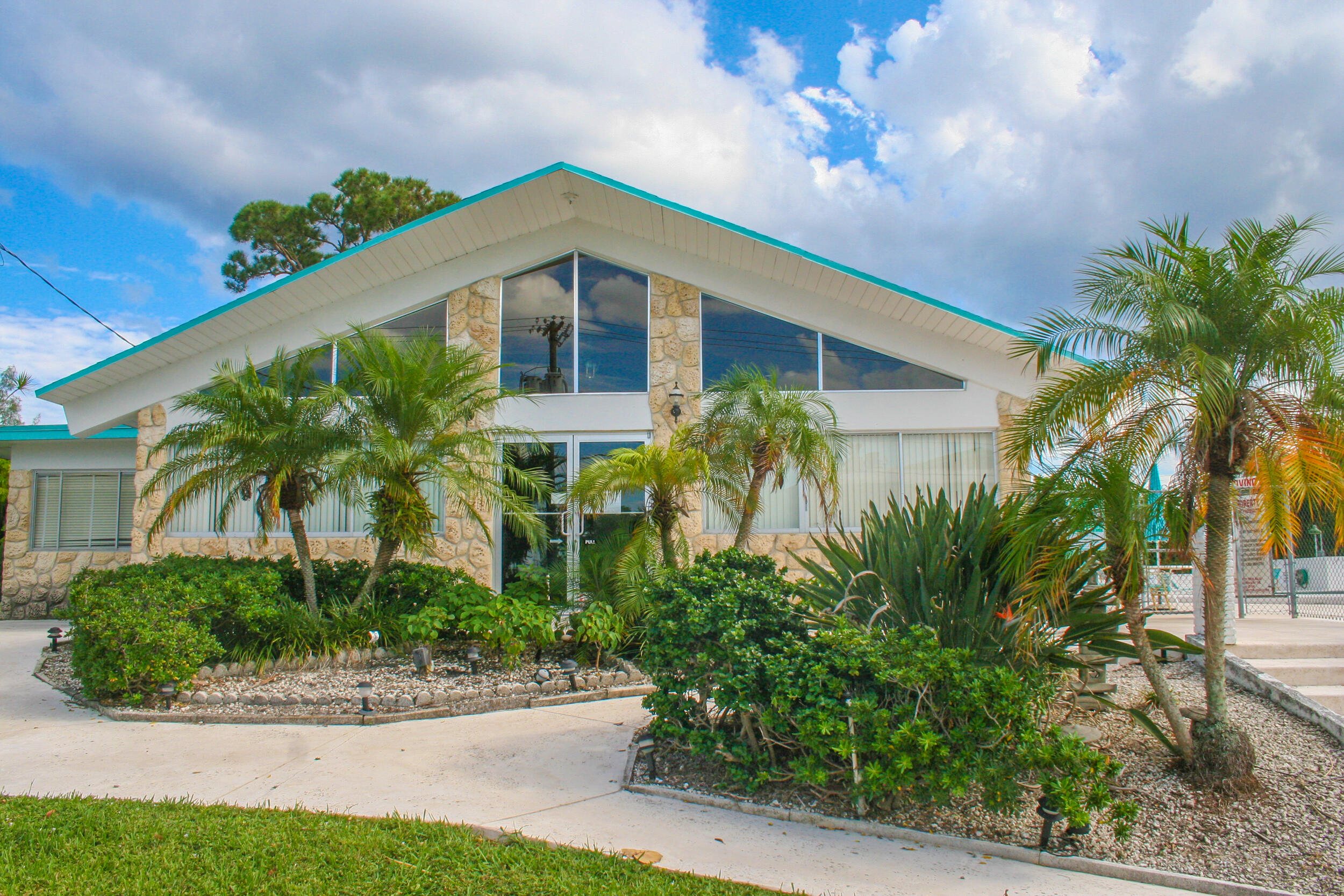 2004 Lake Osborne Drive, Unit 1 Lake Worth Beach, FL 33461 - Photo 30 of 30 a front view of a house with a yard
