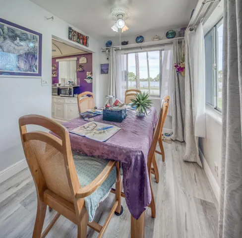 a dining room with furniture and window