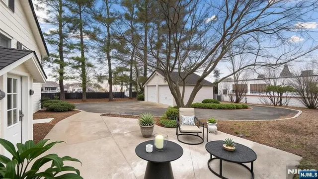 a view of a backyard with sitting area