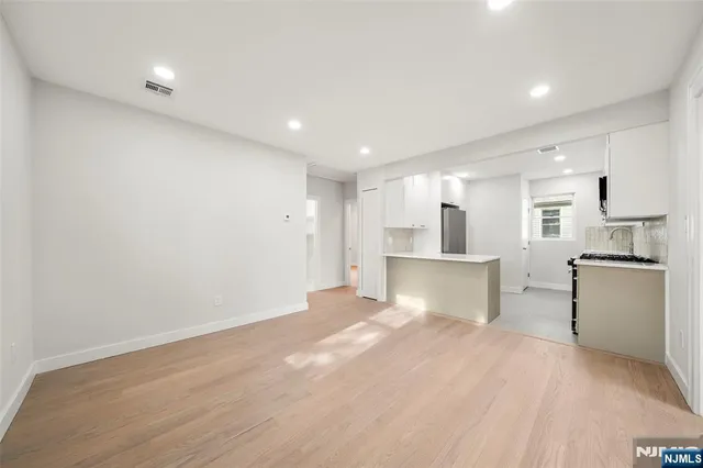 a view of kitchen with wooden floor