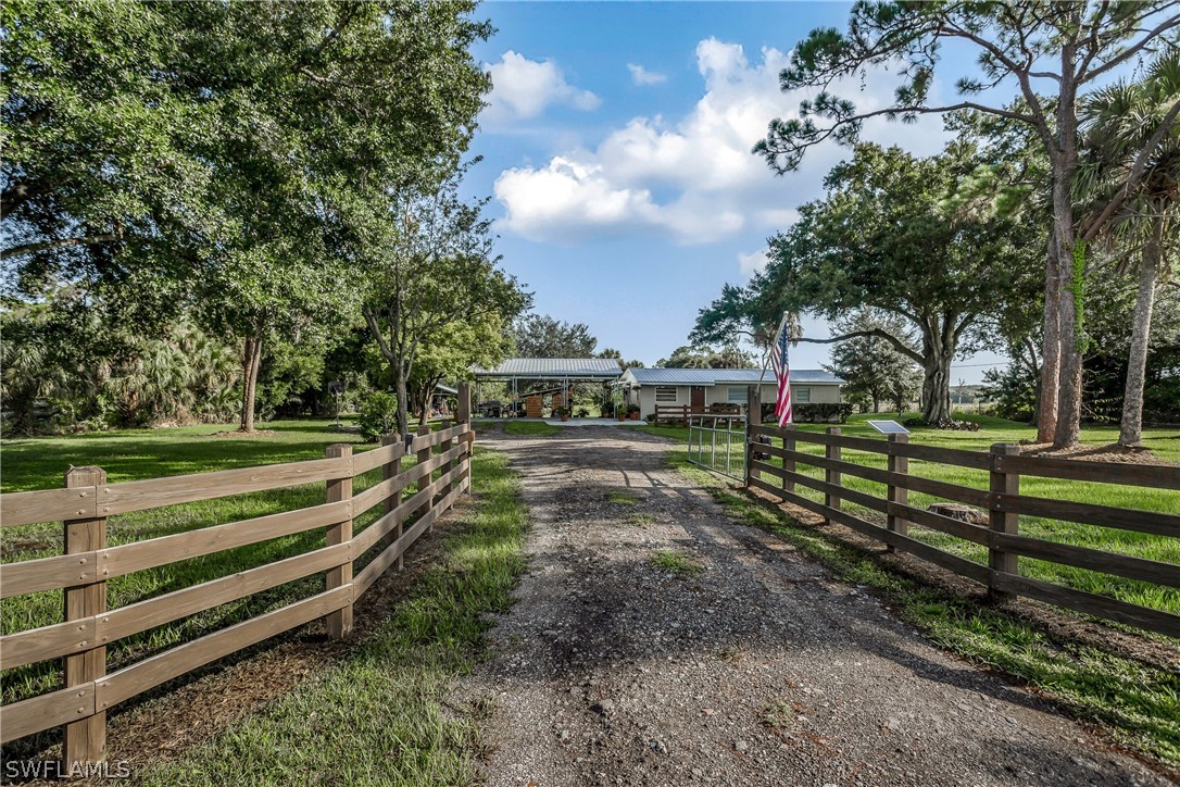 23751 North River Road Alva, FL 33920 - Photo 1 of 34 a view of a park with large trees