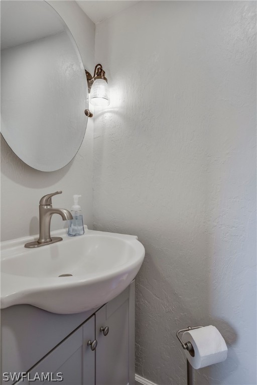 23751 North River Road Alva, FL 33920 - Photo 19 of 34 a bathroom with a sink and a mirror