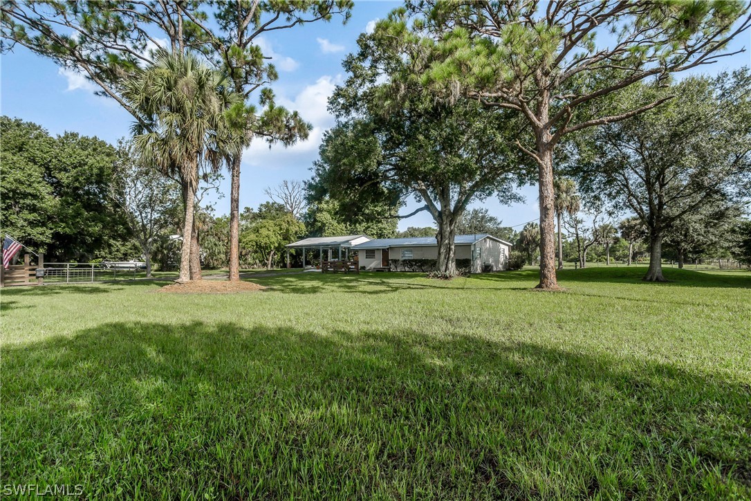 23751 North River Road Alva, FL 33920 - Photo 20 of 34 a view of a house with a yard