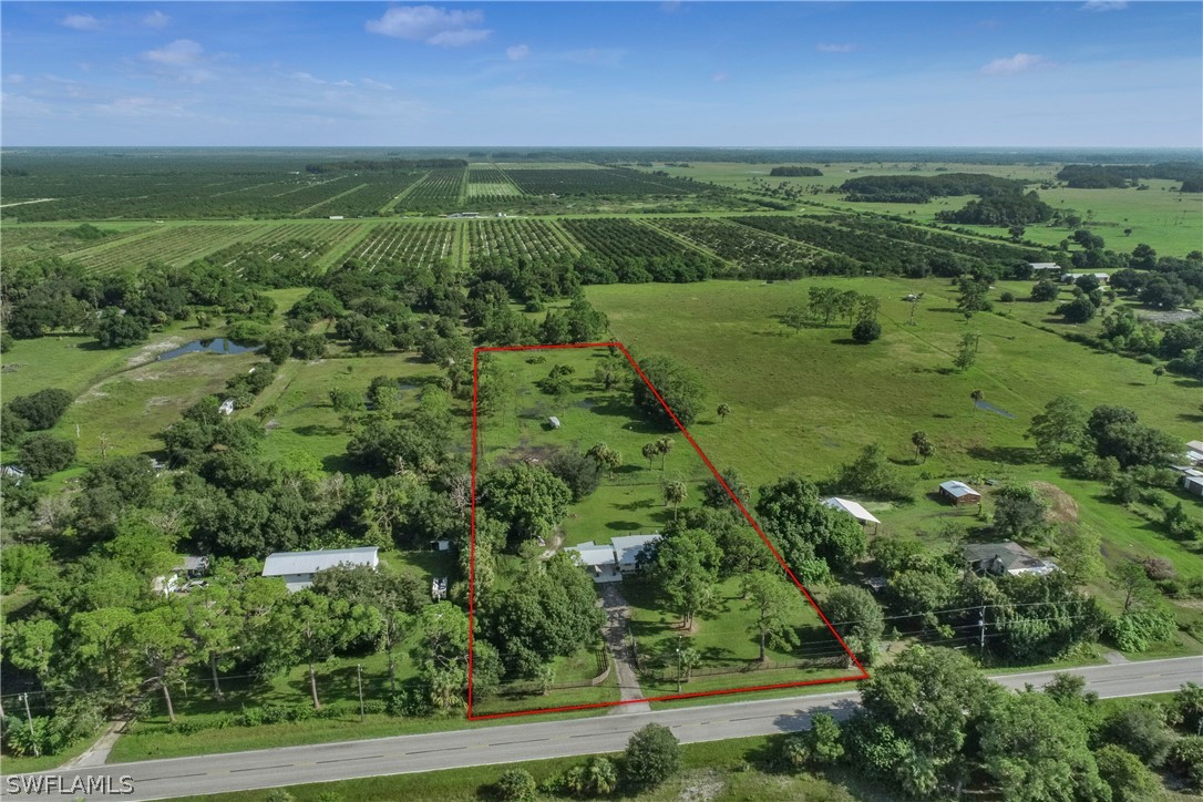 23751 North River Road Alva, FL 33920 - Photo 2 of 34 a view of a green field with lots of plants in it