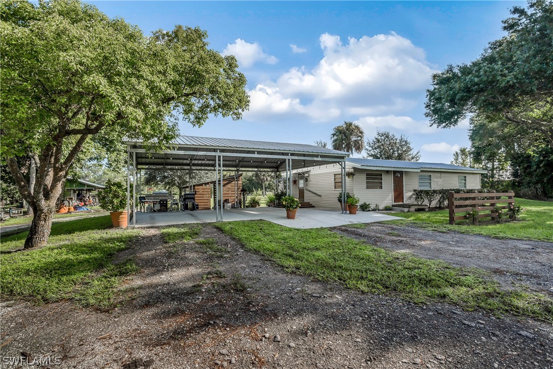 23751 North River Road Alva, FL 33920 - Photo 22 of 34 a view of a yard in front of house