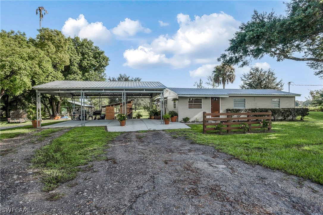 23751 North River Road Alva, FL 33920 - Photo 4 of 34 a view of an house with backyard space and balcony