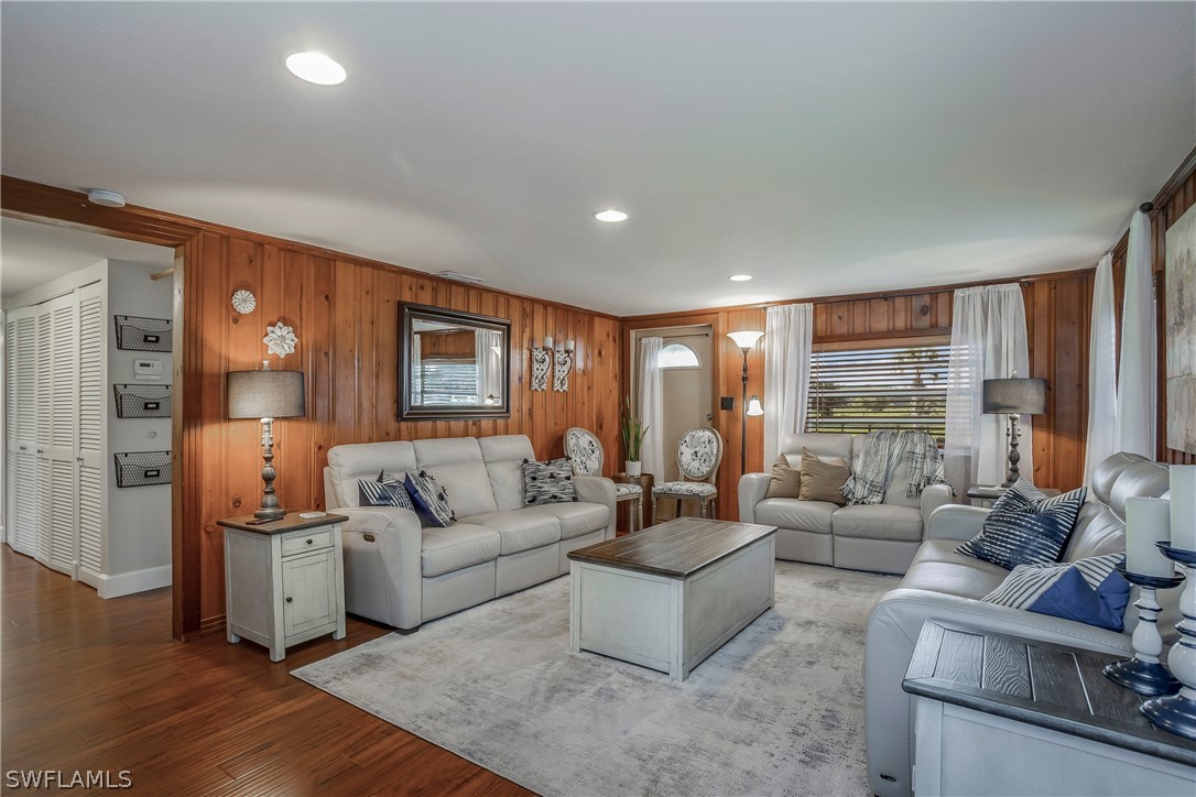 23751 North River Road Alva, FL 33920 - Photo 5 of 34 a living room with furniture and a large window