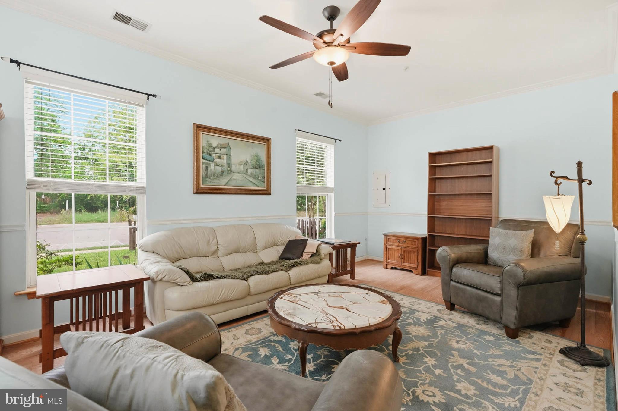 8721 Spring Brook Way Odenton, MD 21113 - Photo 5 of 40 a living room with furniture and a window